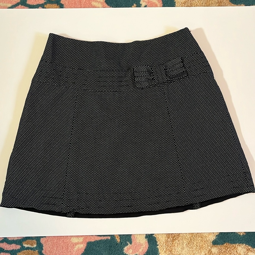 Super cute, black white polkadot mini skirt with subtle bow accent